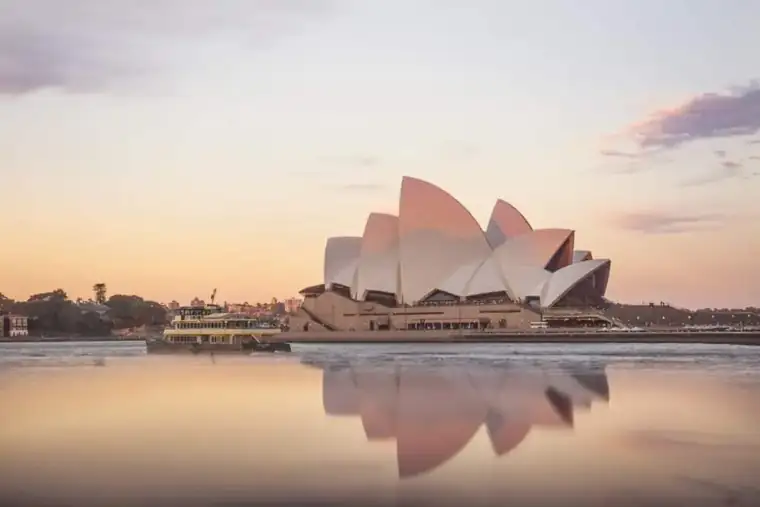 Sydney Opera House at sunset reflecting on the harbour
